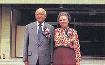 Dr. Stokes and his wife in front of his memorial building